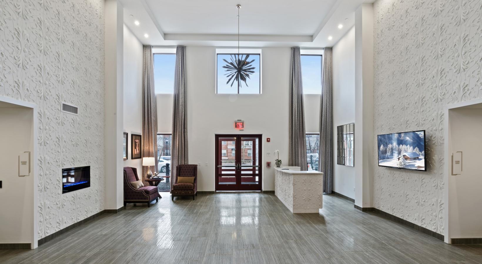 Everything within reach a large room with a wood floor and a wood floor