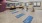 a room with exercise equipment and mats