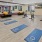 a room with exercise equipment and mats