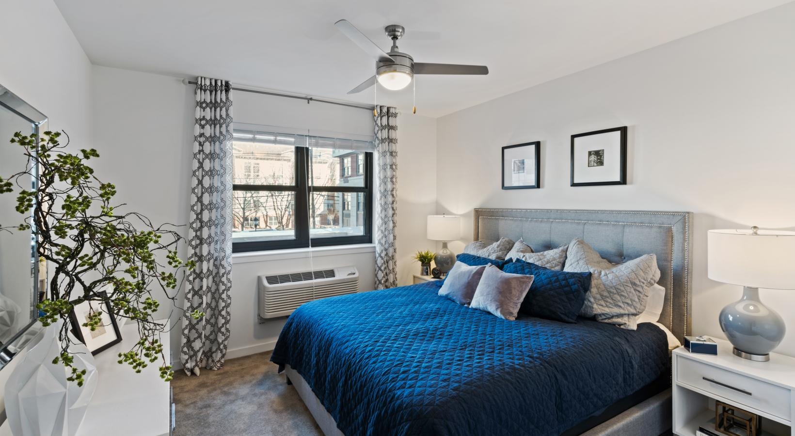 Generous bedroom offerings to fit every family a bedroom with a bed and a plant