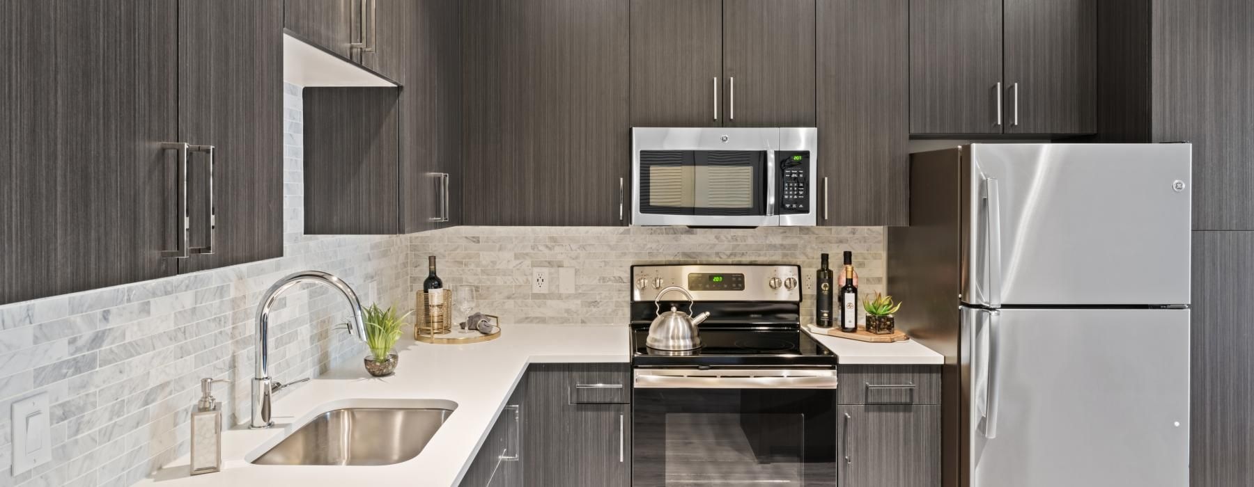 a kitchen with black cabinets