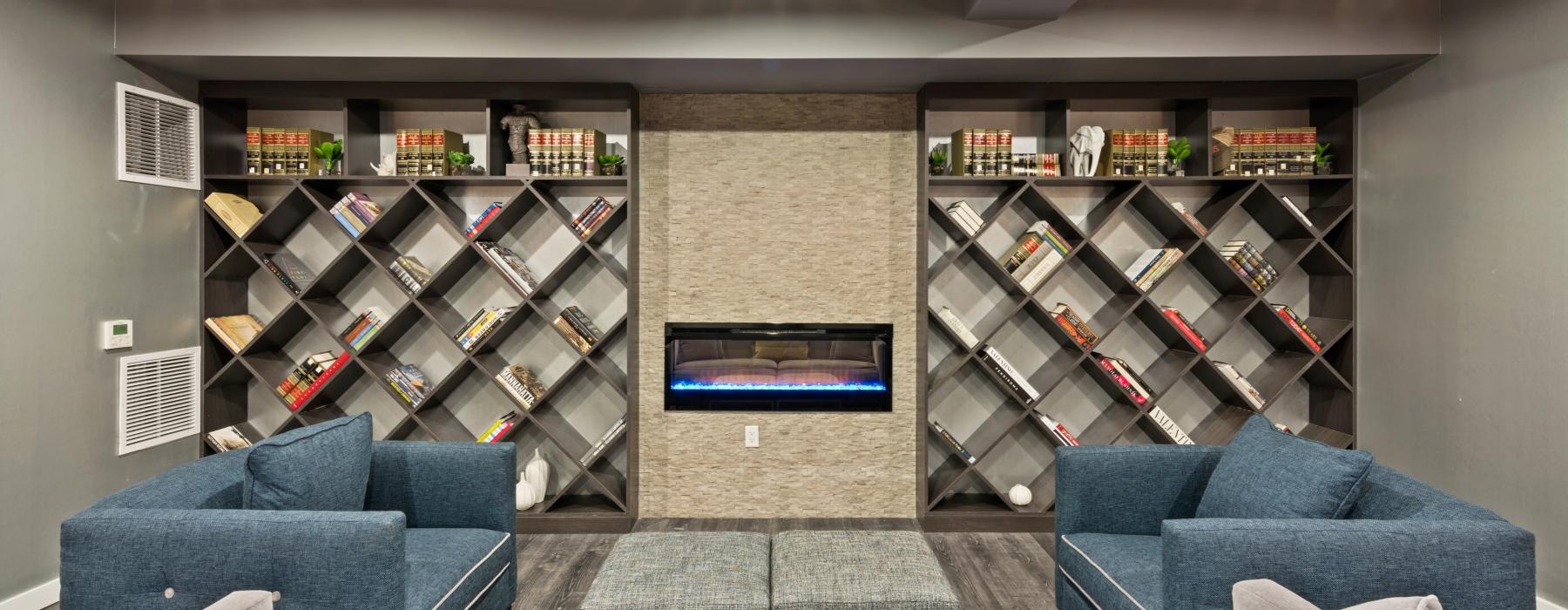 a lounge room with a tv and shelves