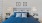 a bed with blue pillows