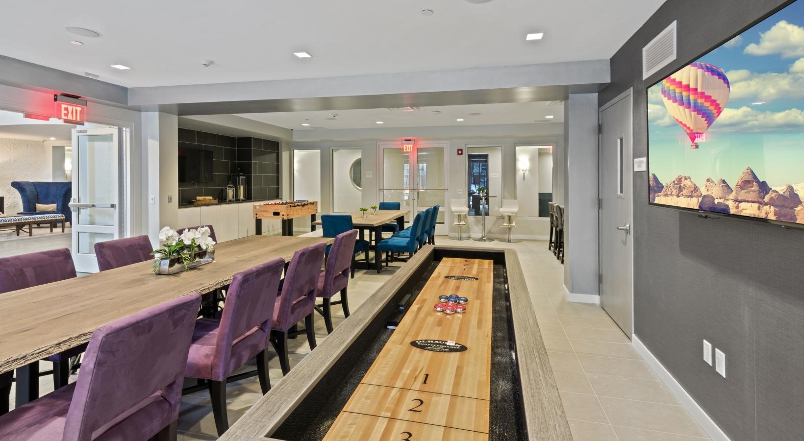Access to resident-only features a long table with chairs around it