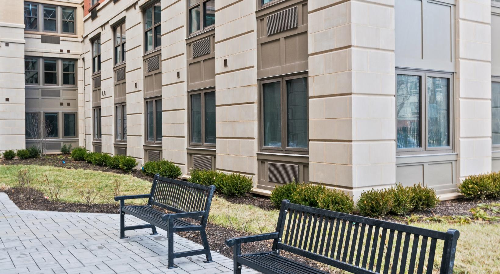 Settle into comfort at The Quincy benches in front of a building