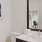a bathroom with a large mirror