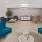 a room with blue chairs and a table