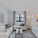 a living room with a white couch and a white table